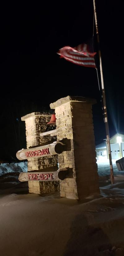 RFD sign in snow at night